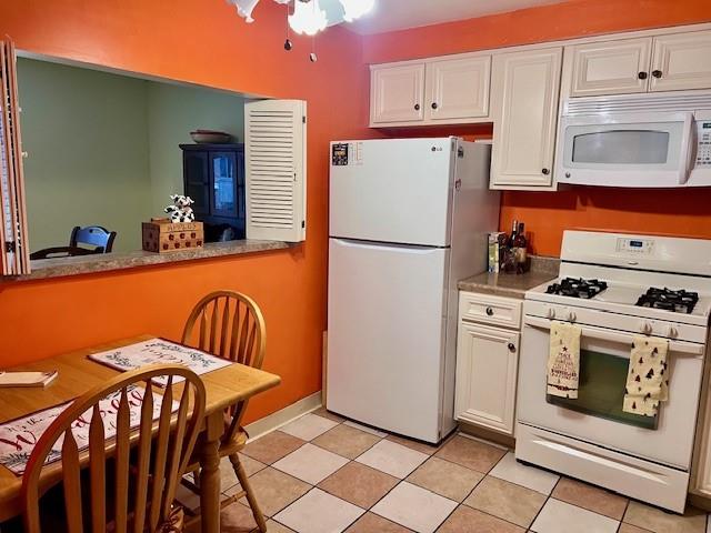 264 Elm Court Pittsburgh, PA 15237 - Photo 7 of 28 a kitchen with a white stove top oven and refrigerator