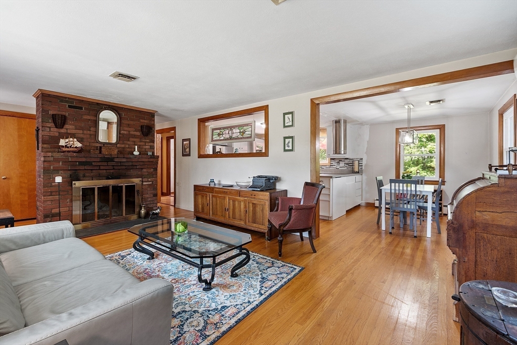 275 Cordaville Road Ashland, MA 01721 - Photo 11 of 39 a living room with furniture a flat screen tv and a fireplace