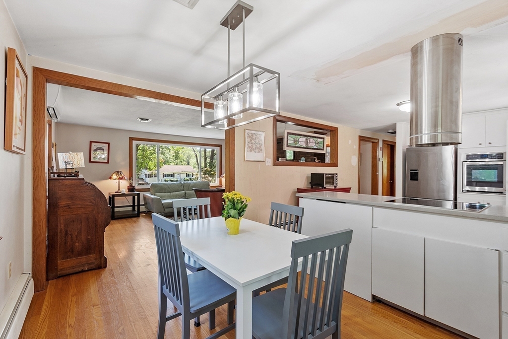 275 Cordaville Road Ashland, MA 01721 - Photo 14 of 39 a view of a dining room with furniture window and wooden floor