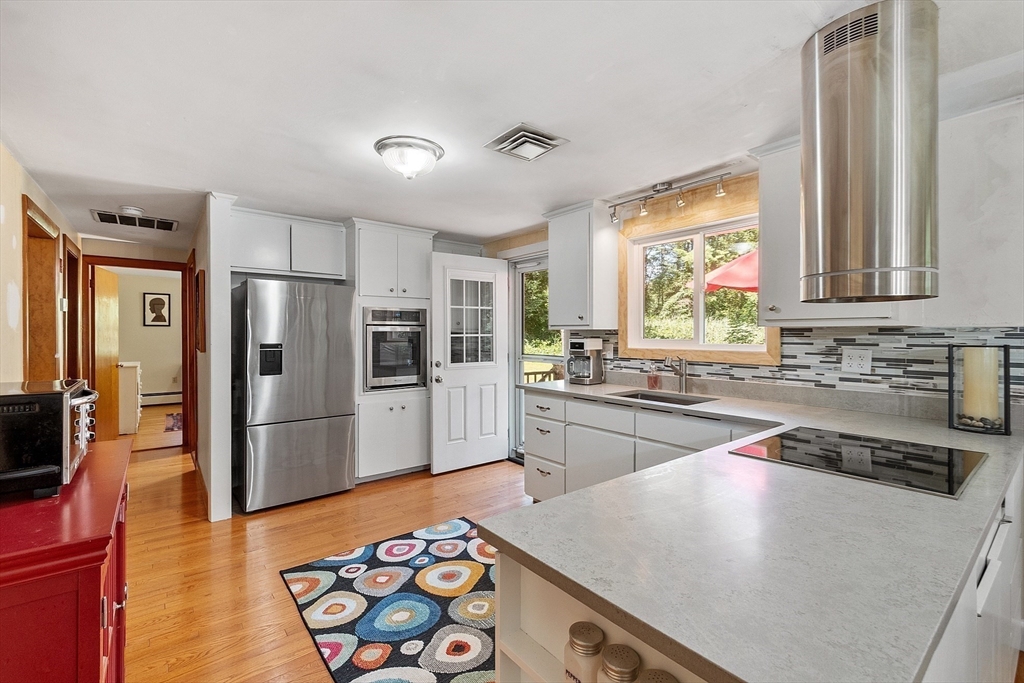 275 Cordaville Road Ashland, MA 01721 - Photo 15 of 39 a kitchen with stainless steel appliances granite countertop a refrigerator a stove and a sink