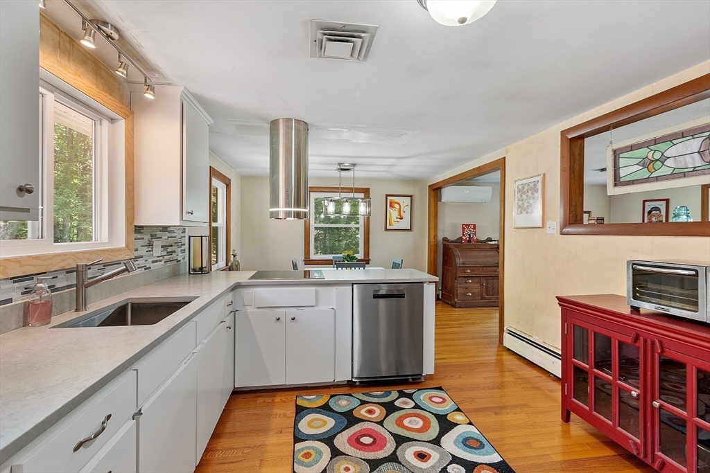 275 Cordaville Road Ashland, MA 01721 - Photo 19 of 39 a kitchen with stainless steel appliances granite countertop a sink stove and cabinets
