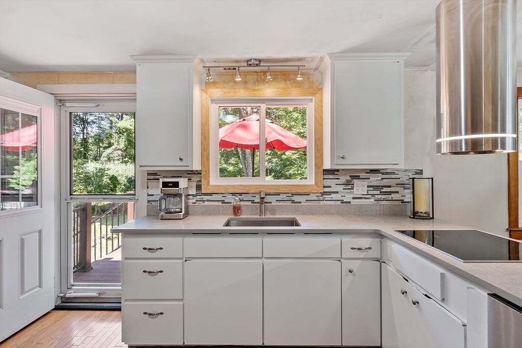 275 Cordaville Road Ashland, MA 01721 - Photo 20 of 39 a kitchen with white cabinets and a large window