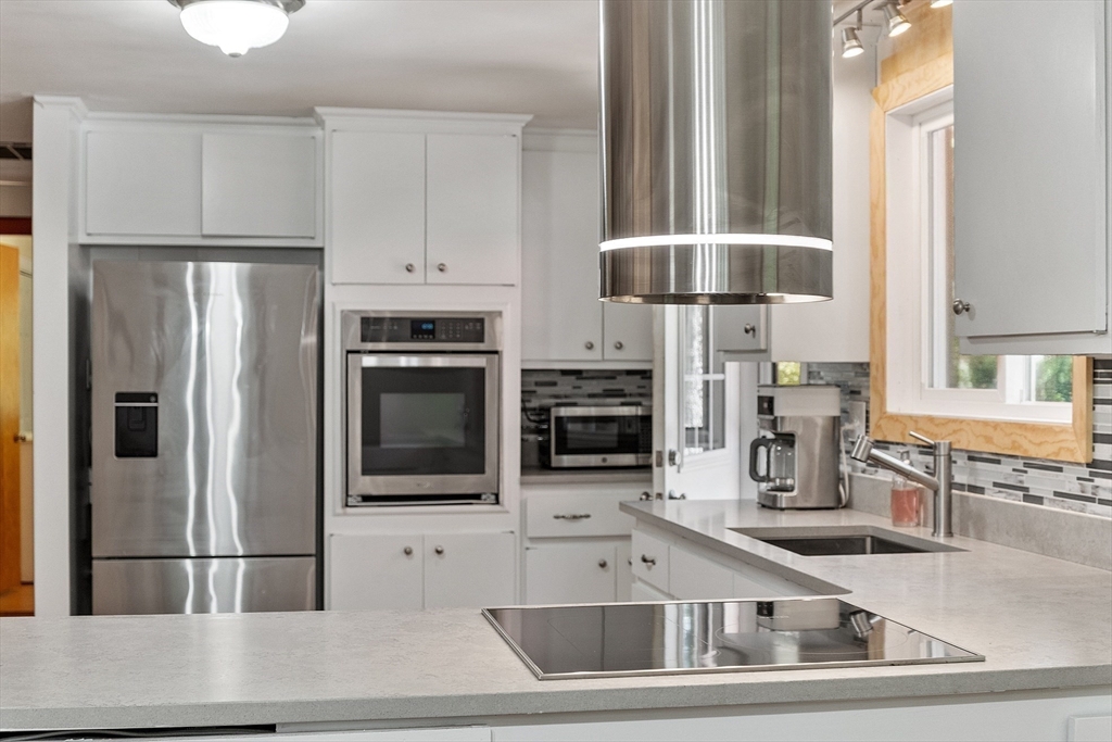 275 Cordaville Road Ashland, MA 01721 - Photo 21 of 39 a kitchen with stainless steel appliances granite countertop a refrigerator and a stove top oven