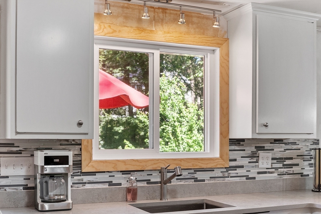 275 Cordaville Road Ashland, MA 01721 - Photo 22 of 39 a kitchen with a stove a sink and a microwave