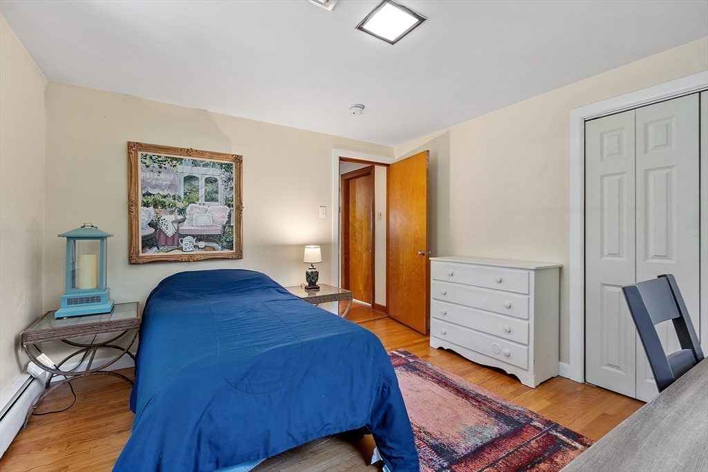 275 Cordaville Road Ashland, MA 01721 - Photo 27 of 39 a bedroom with a bed and furniture