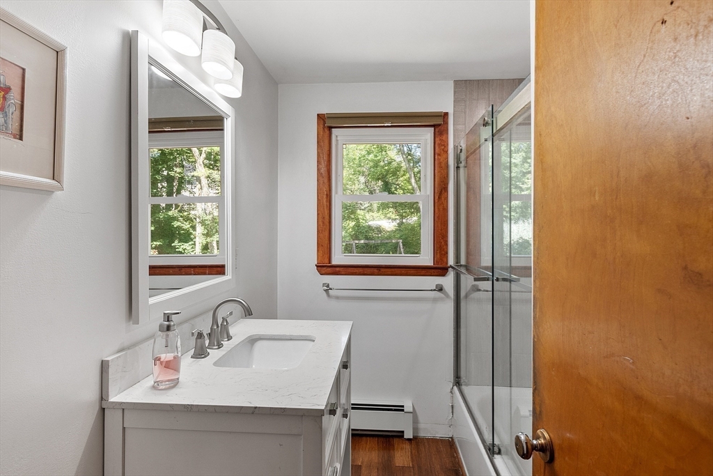 275 Cordaville Road Ashland, MA 01721 - Photo 28 of 39 a bathroom with a sink a vanity and a mirror