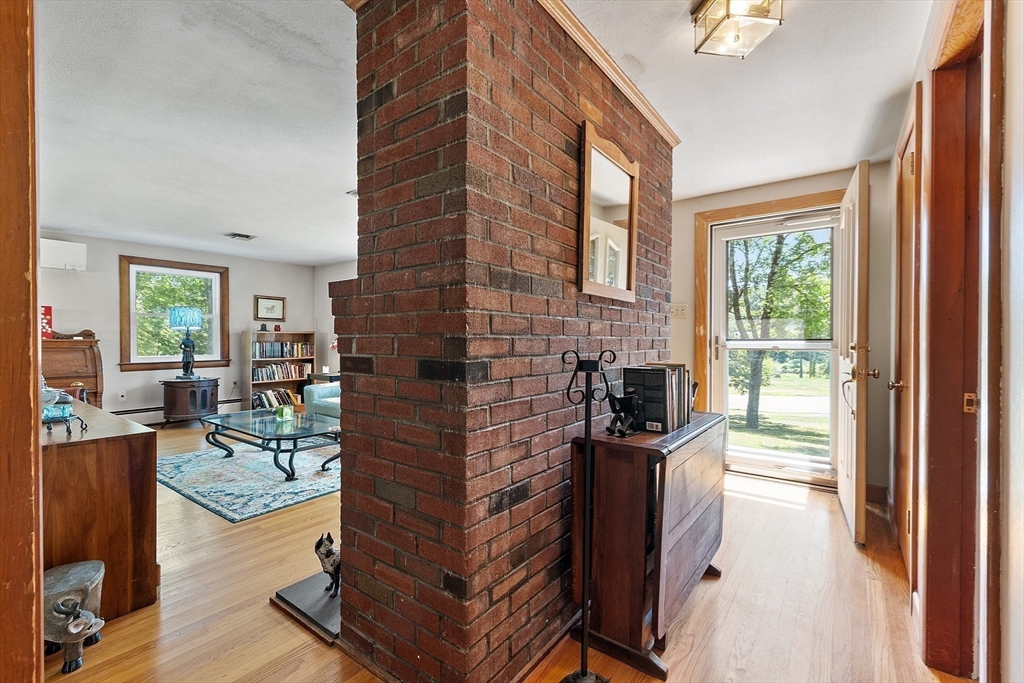 275 Cordaville Road Ashland, MA 01721 - Photo 5 of 39 a living room with furniture a fireplace and a flat screen tv