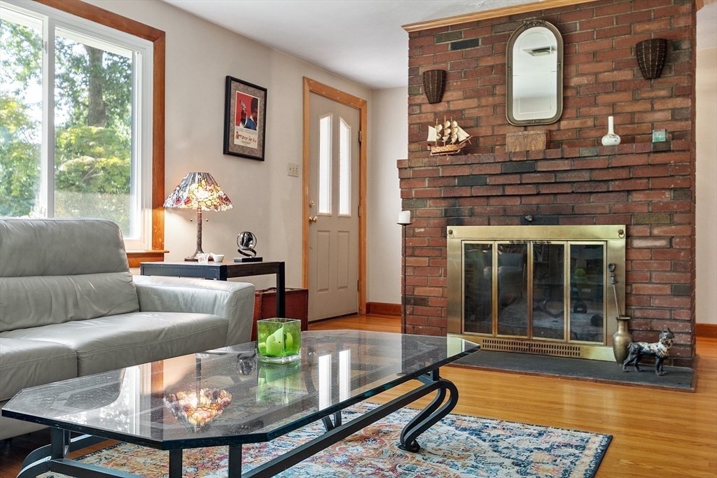275 Cordaville Road Ashland, MA 01721 - Photo 10 of 39 a living room with furniture and a fireplace