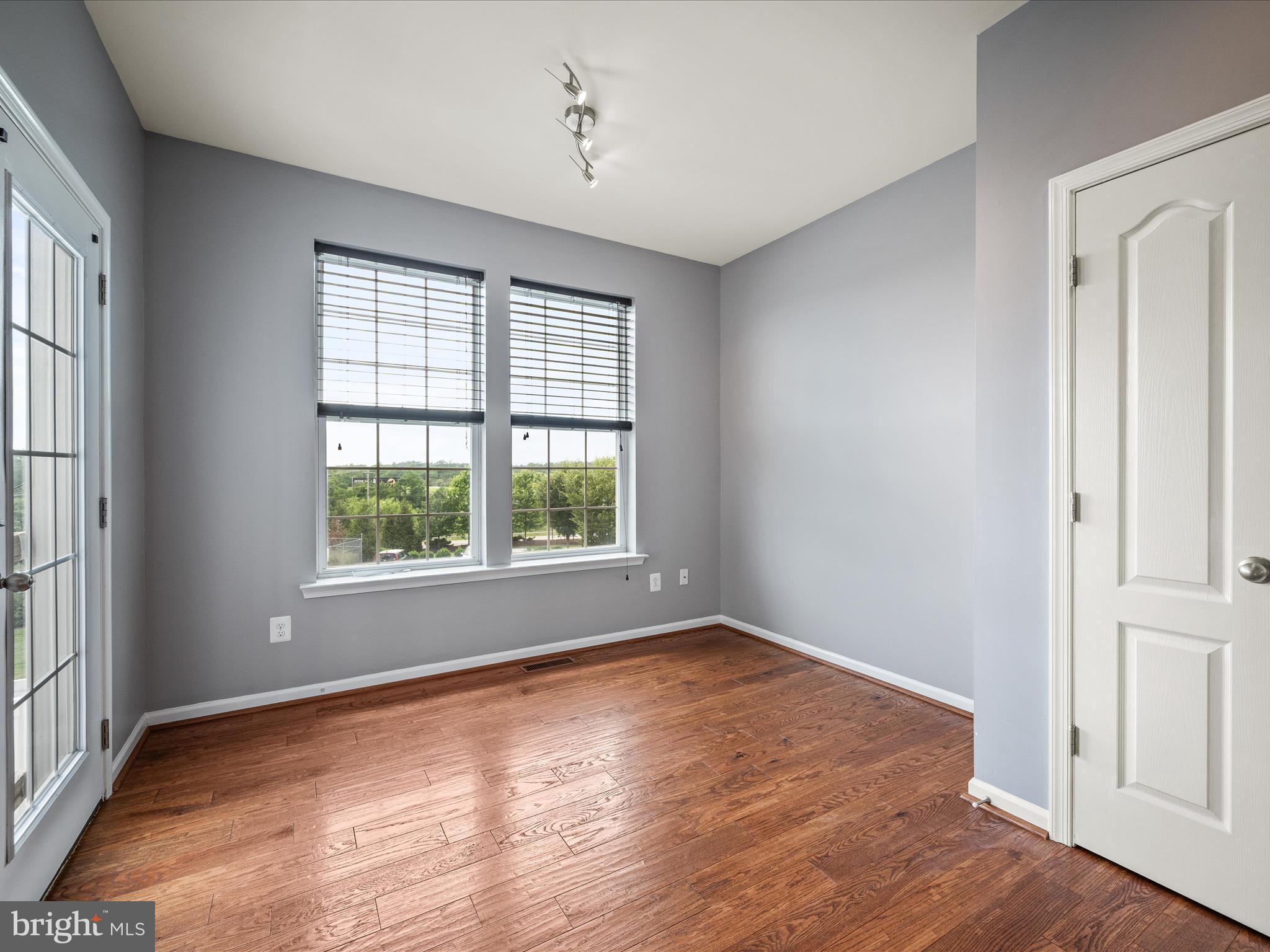 247 Schramm Loop Stephens City, VA 22655 - Photo 13 of 34 a view of an empty room with wooden floor and a window