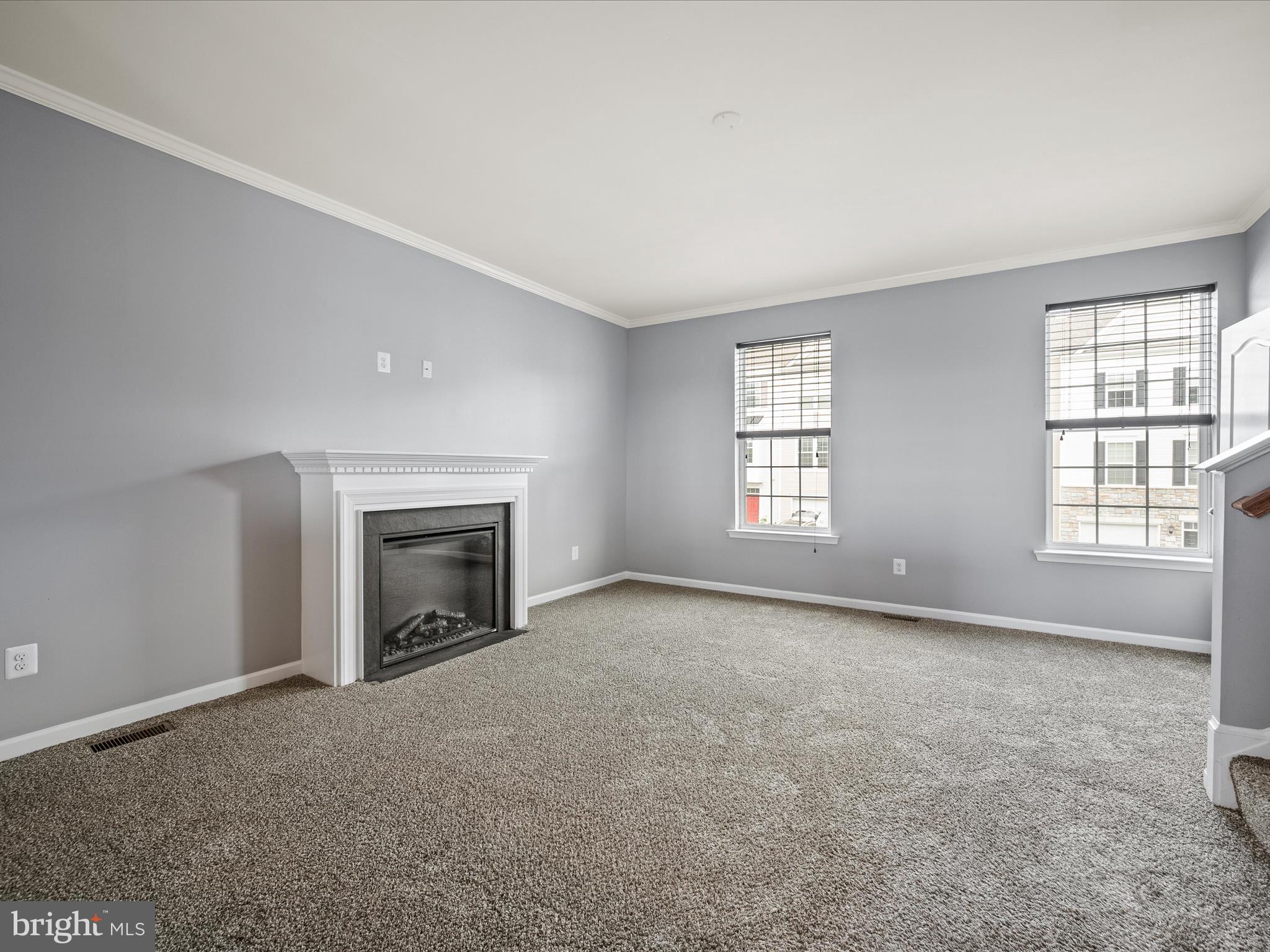 247 Schramm Loop Stephens City, VA 22655 - Photo 14 of 34 an empty room with windows and fireplace