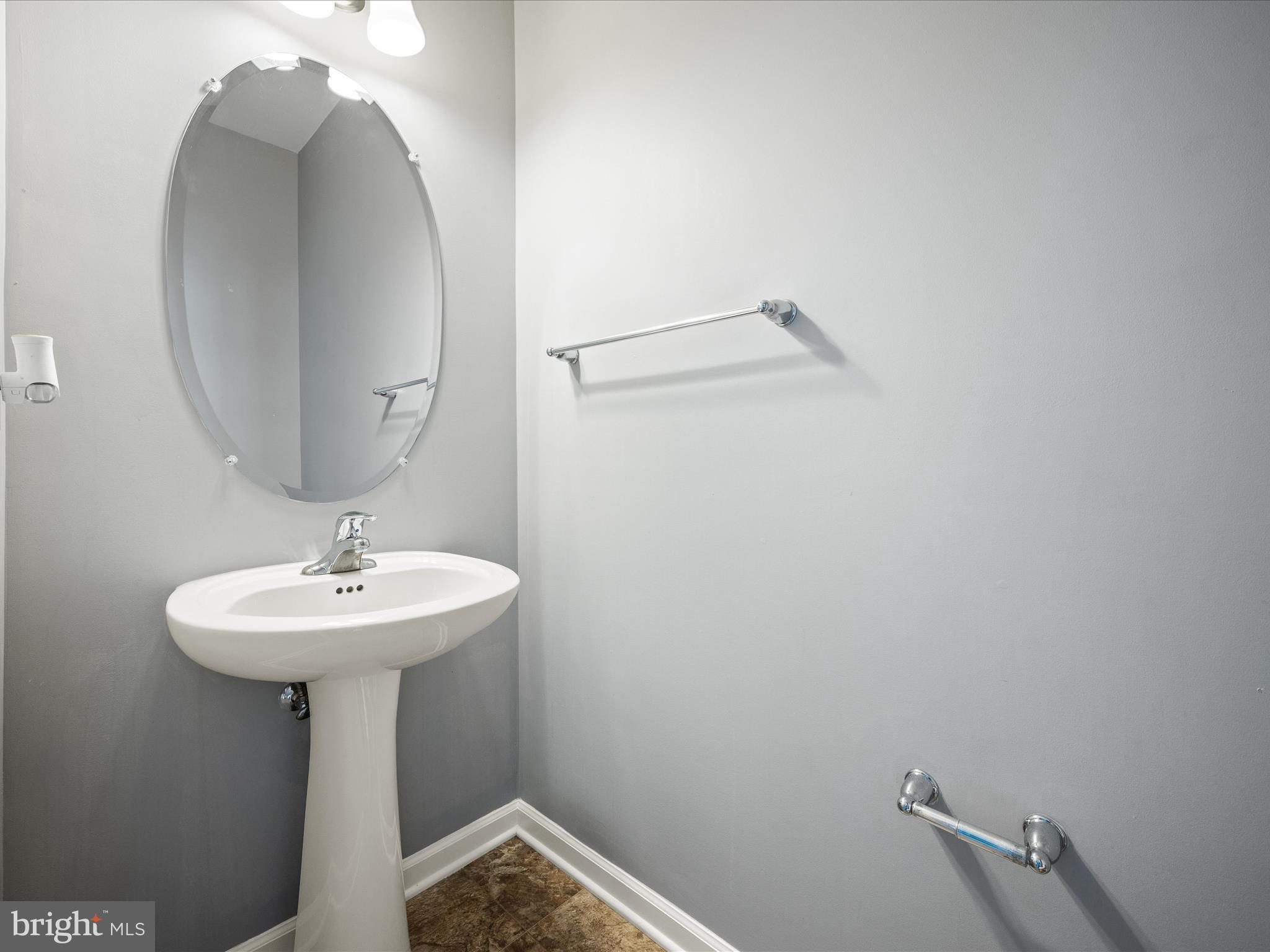 247 Schramm Loop Stephens City, VA 22655 - Photo 17 of 34 a bathroom with a sink a mirror and shower