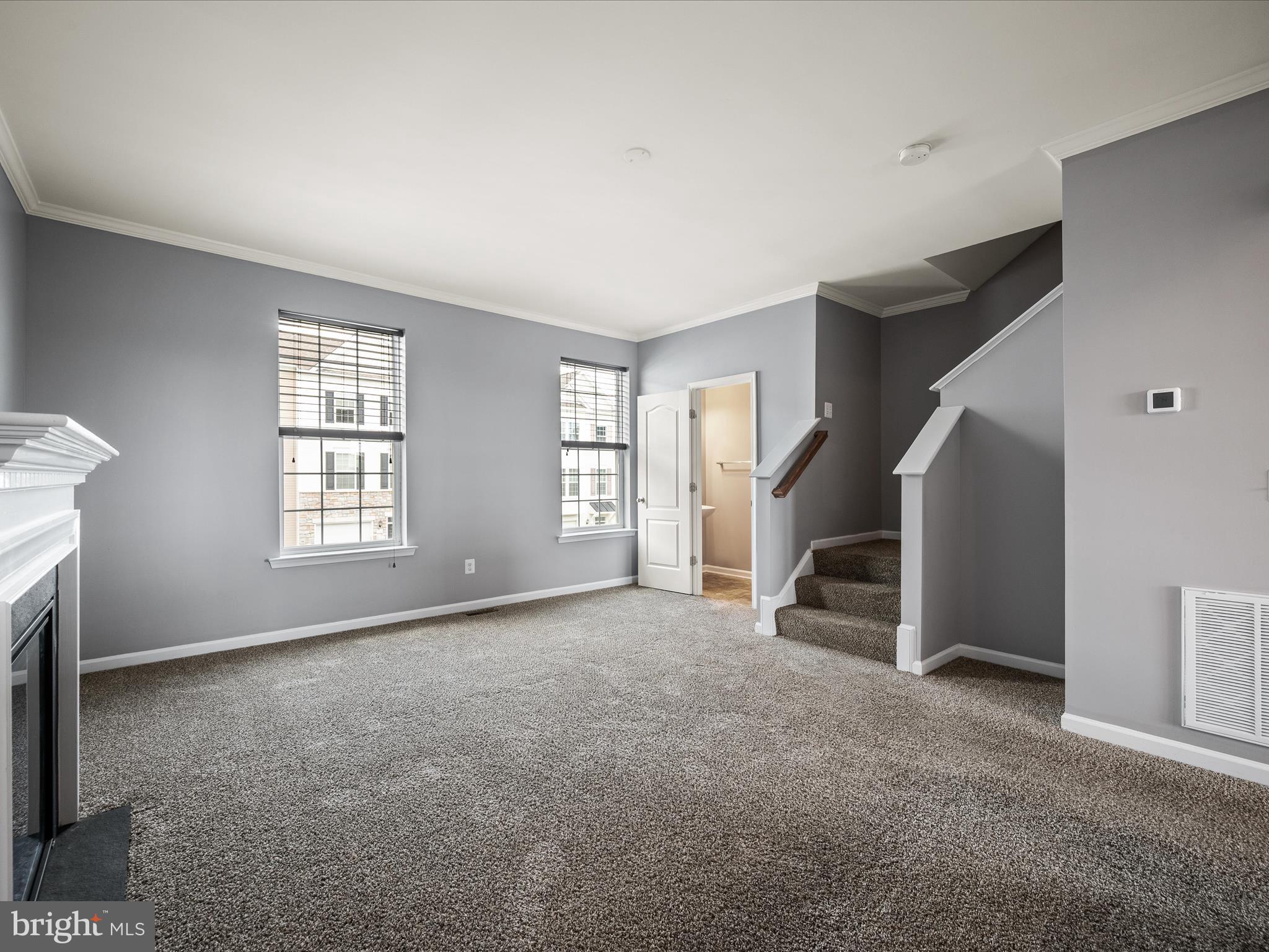 247 Schramm Loop Stephens City, VA 22655 - Photo 18 of 34 an empty room with windows and stairs