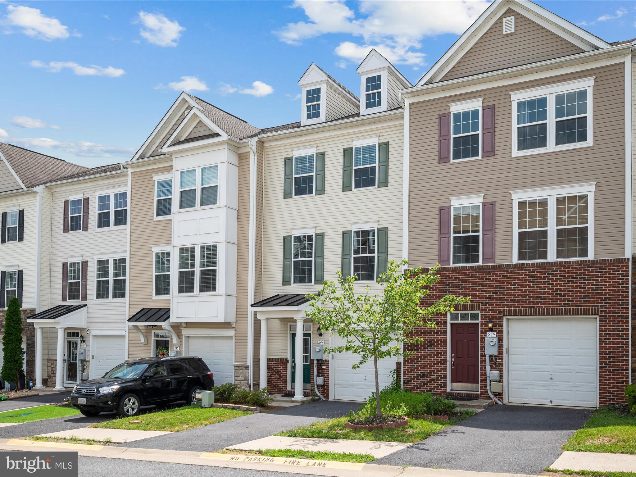 247 Schramm Loop Stephens City, VA 22655 - Photo 30 of 34 a front view of a building with a yard and car parked