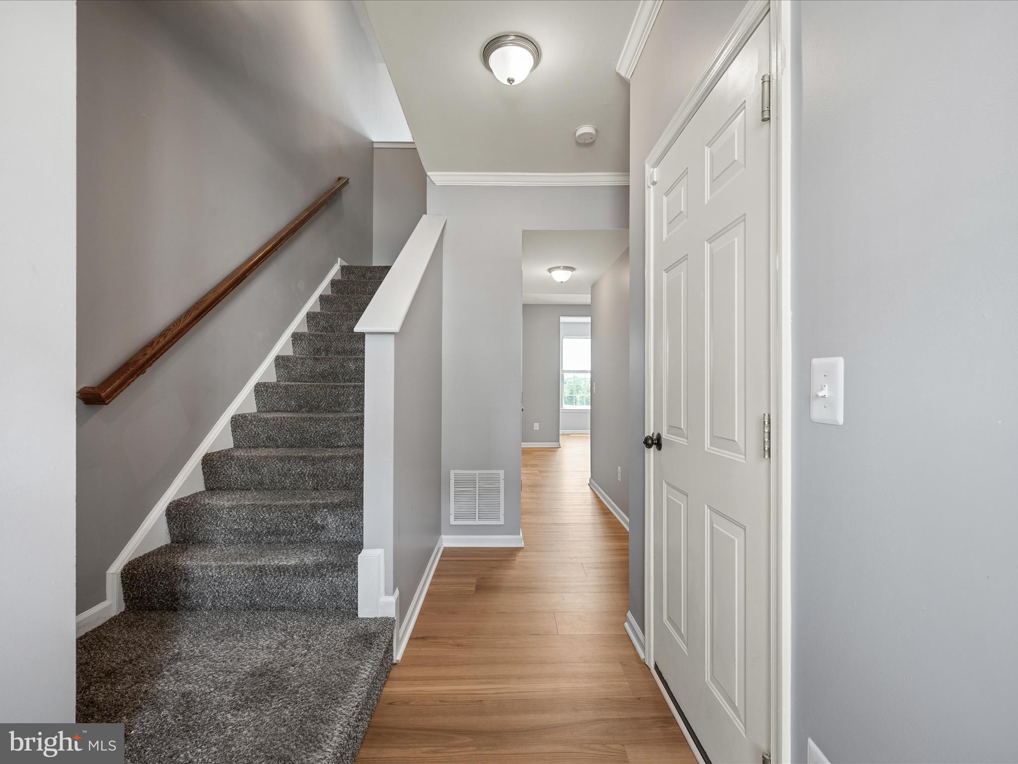 247 Schramm Loop Stephens City, VA 22655 - Photo 3 of 34 a view of a hallway with wooden floor and entryway