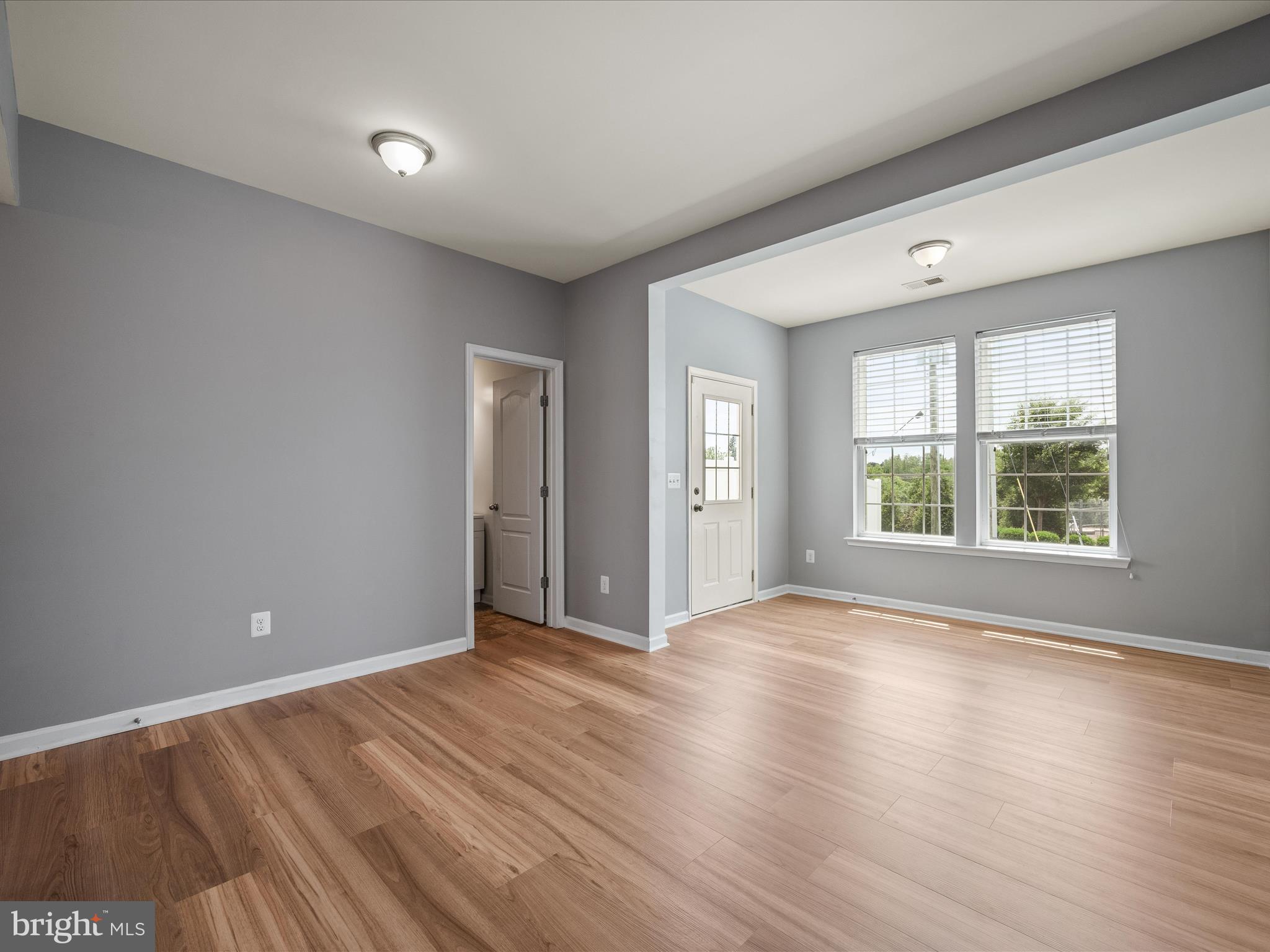 247 Schramm Loop Stephens City, VA 22655 - Photo 5 of 34 a view of an empty room with wooden floor and windows