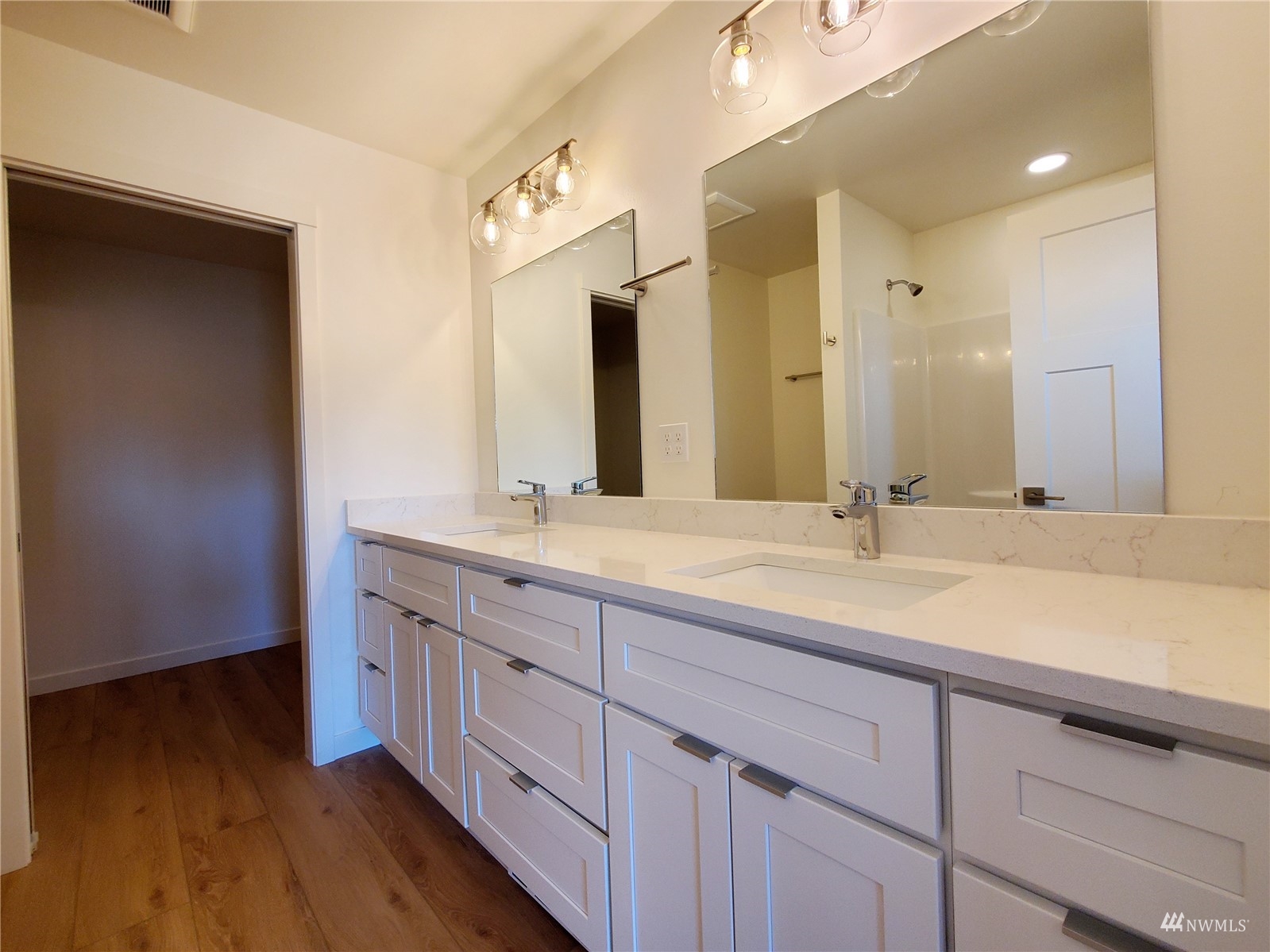 440 Merchants Road Forks, WA 98331 - Photo 13 of 27 a bathroom with a double vanity sink and a mirror