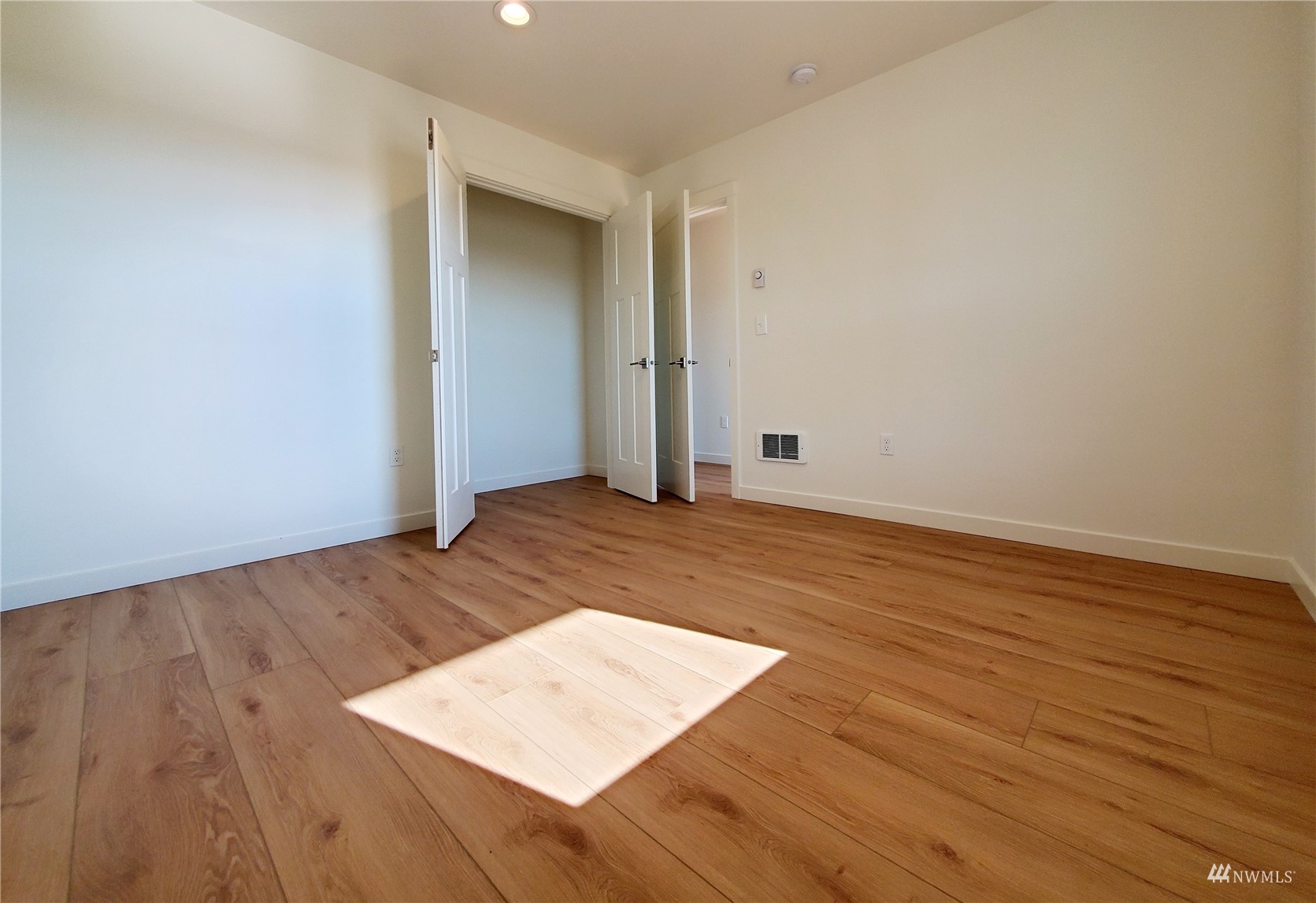 440 Merchants Road Forks, WA 98331 - Photo 14 of 27 an empty room with wooden floor