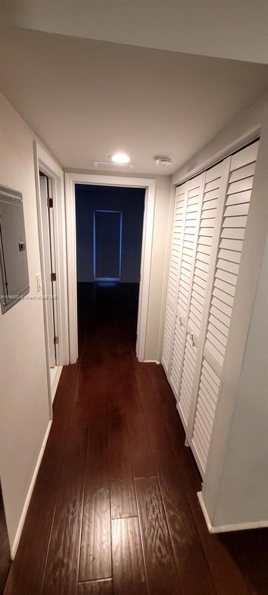 7333 Dickens Avenue, Unit 1 Miami Beach, FL 33141 - Photo 11 of 12 a view of an empty room with wooden floor and a window