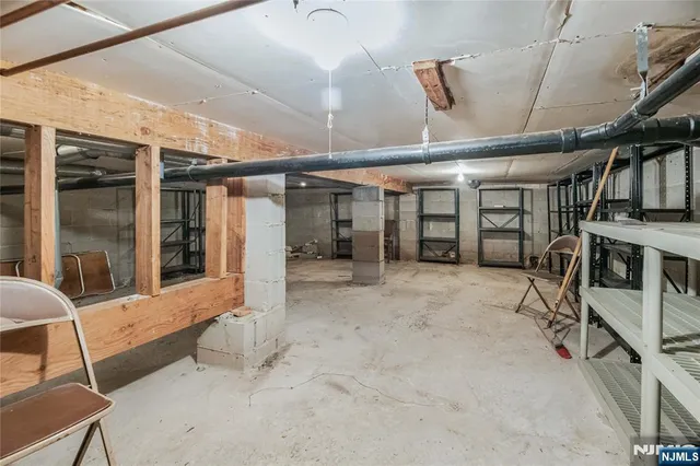 a view of an empty room with furniture