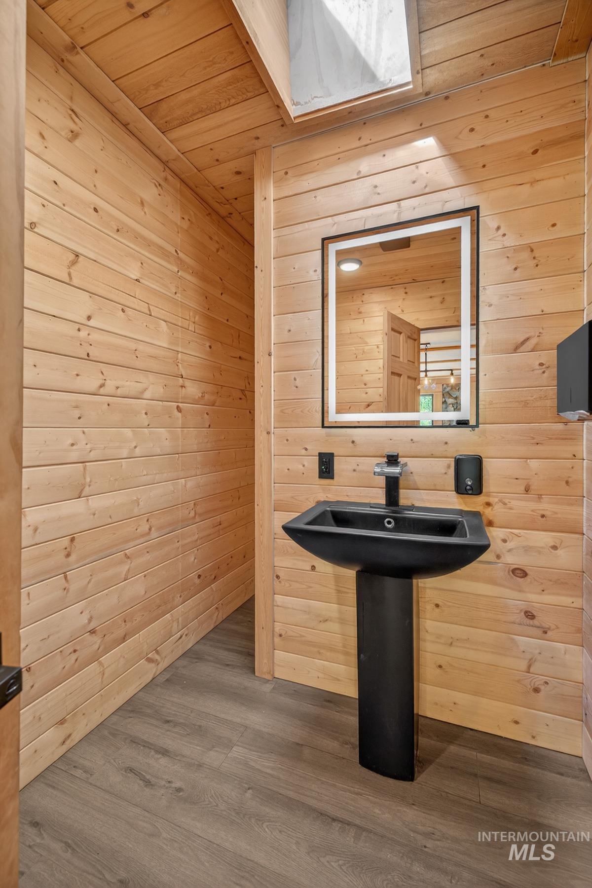 543 North Main Street Riggins, ID 83549 - Photo 29 of 46 Bar with wooden ceiling, wood walls, and dark wood finished floors