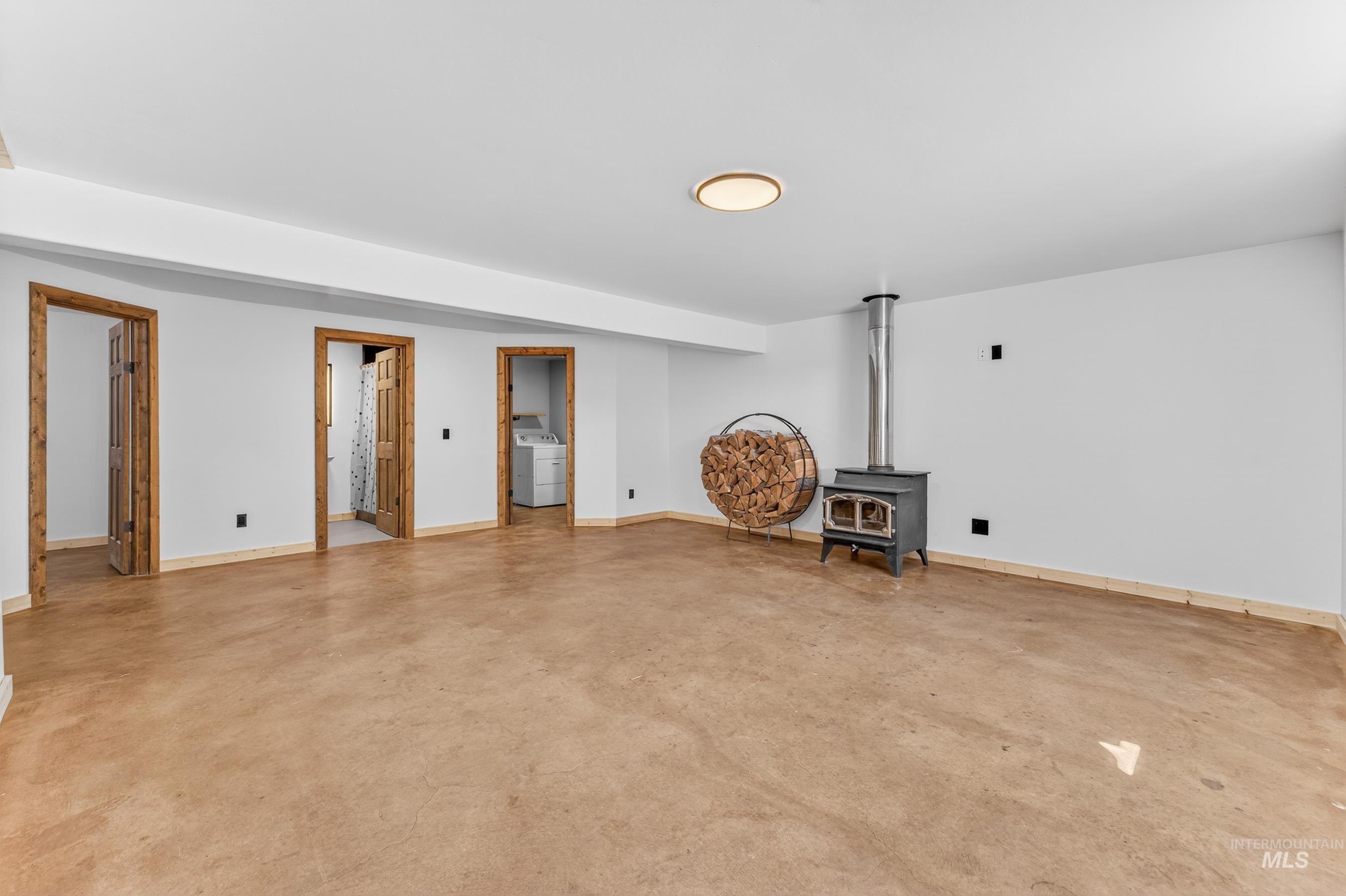 543 North Main Street Riggins, ID 83549 - Photo 33 of 46 Basement with a wood stove and washer / dryer