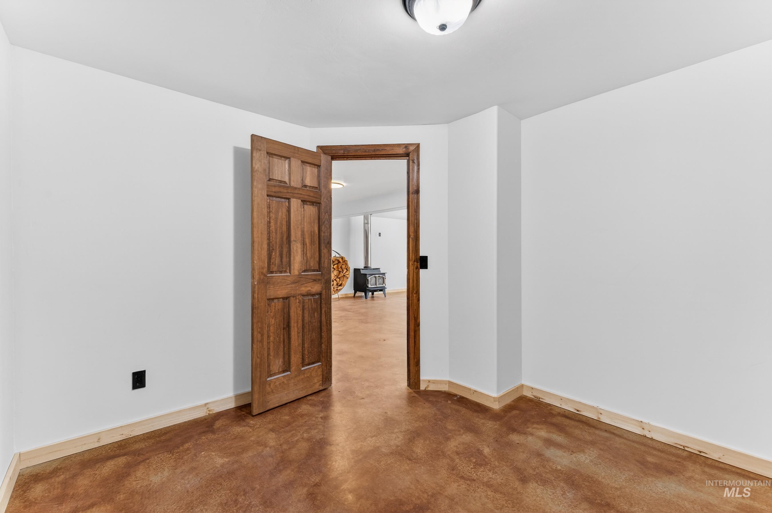 543 North Main Street Riggins, ID 83549 - Photo 34 of 46 Spare room featuring concrete flooring and baseboards