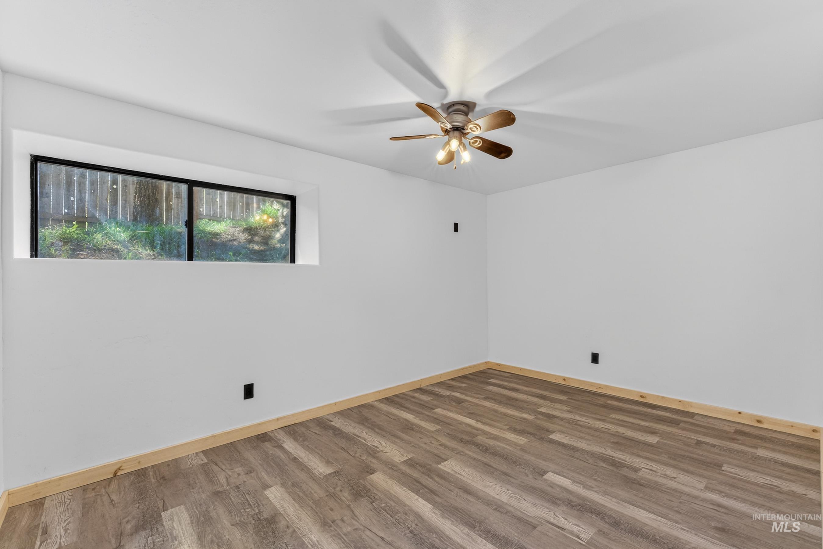 543 North Main Street Riggins, ID 83549 - Photo 38 of 46 Spare room with wood finished floors and a ceiling fan