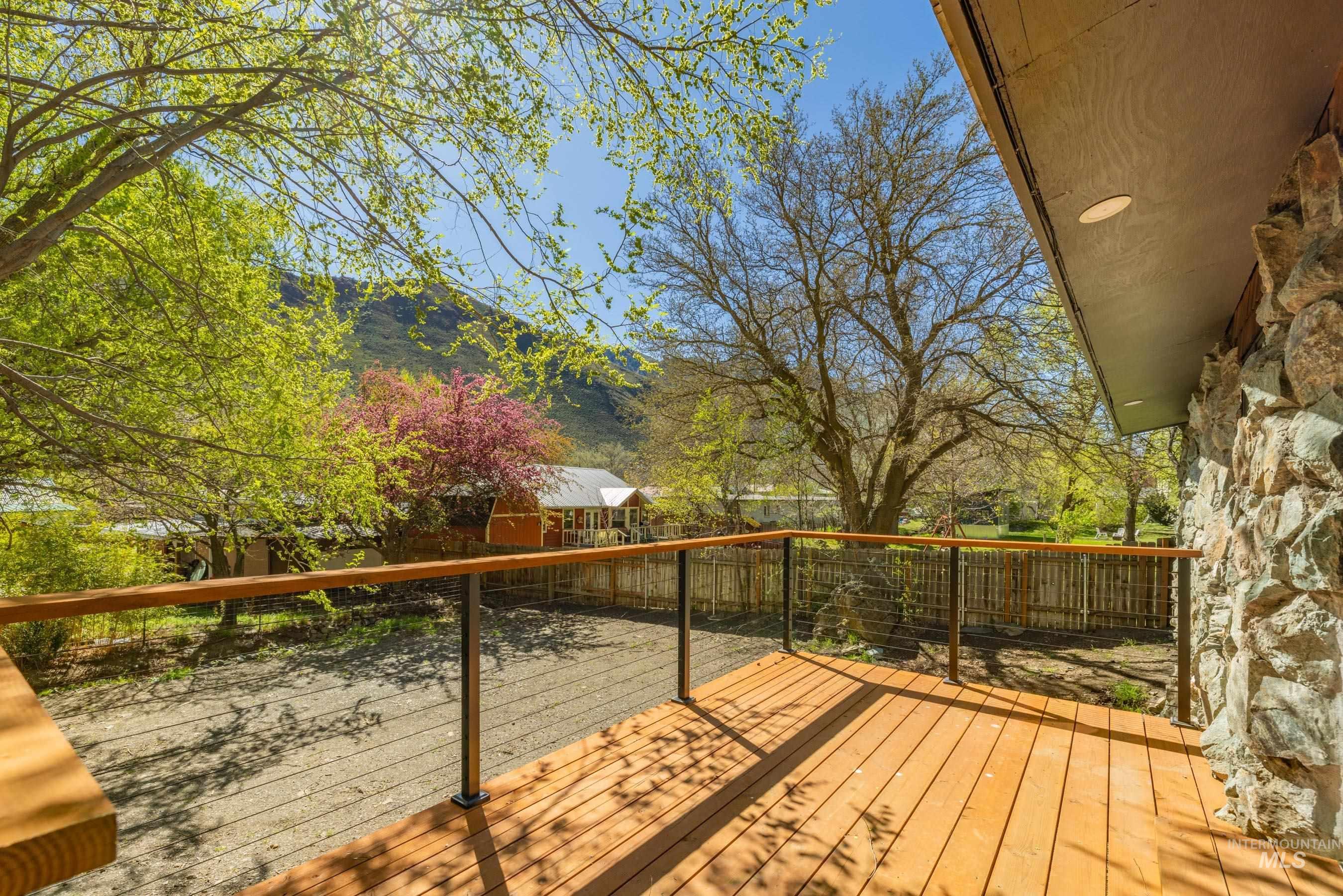 543 North Main Street Riggins, ID 83549 - Photo 5 of 46 Wooden deck with a fenced backyard