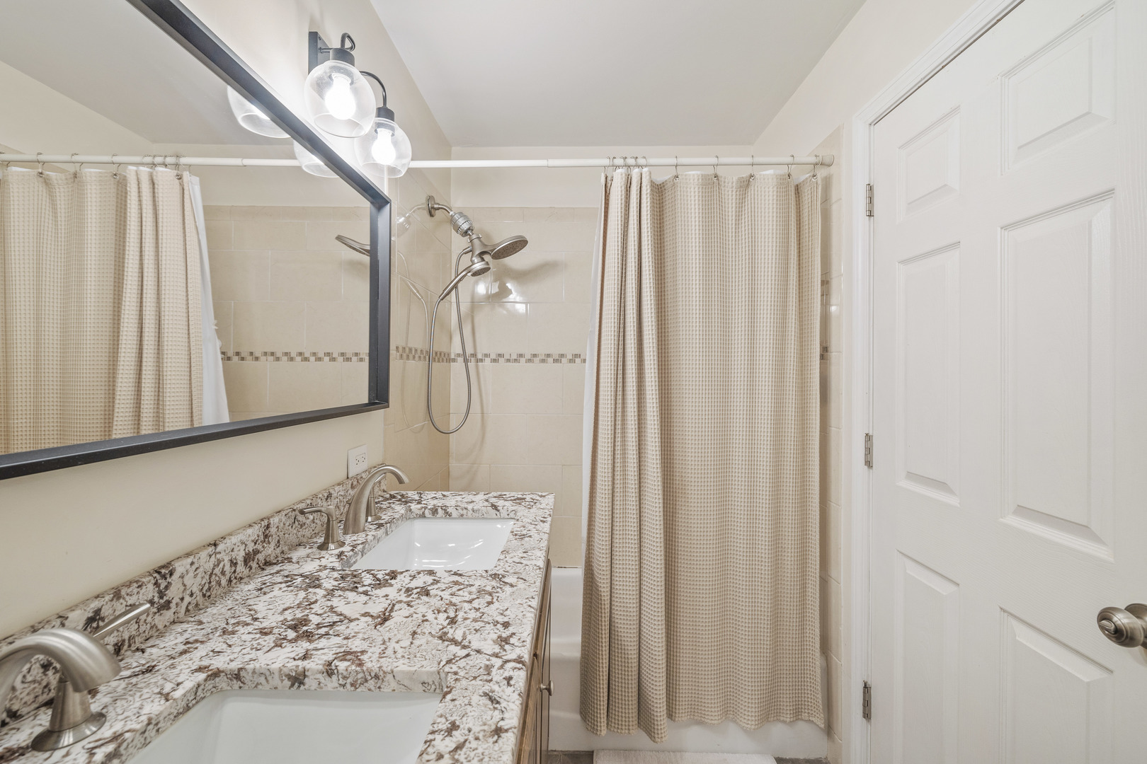 732 Sandy Lane Des Plaines, IL 60016 - Photo 11 of 17 a bathroom with a granite countertop sink and a mirror