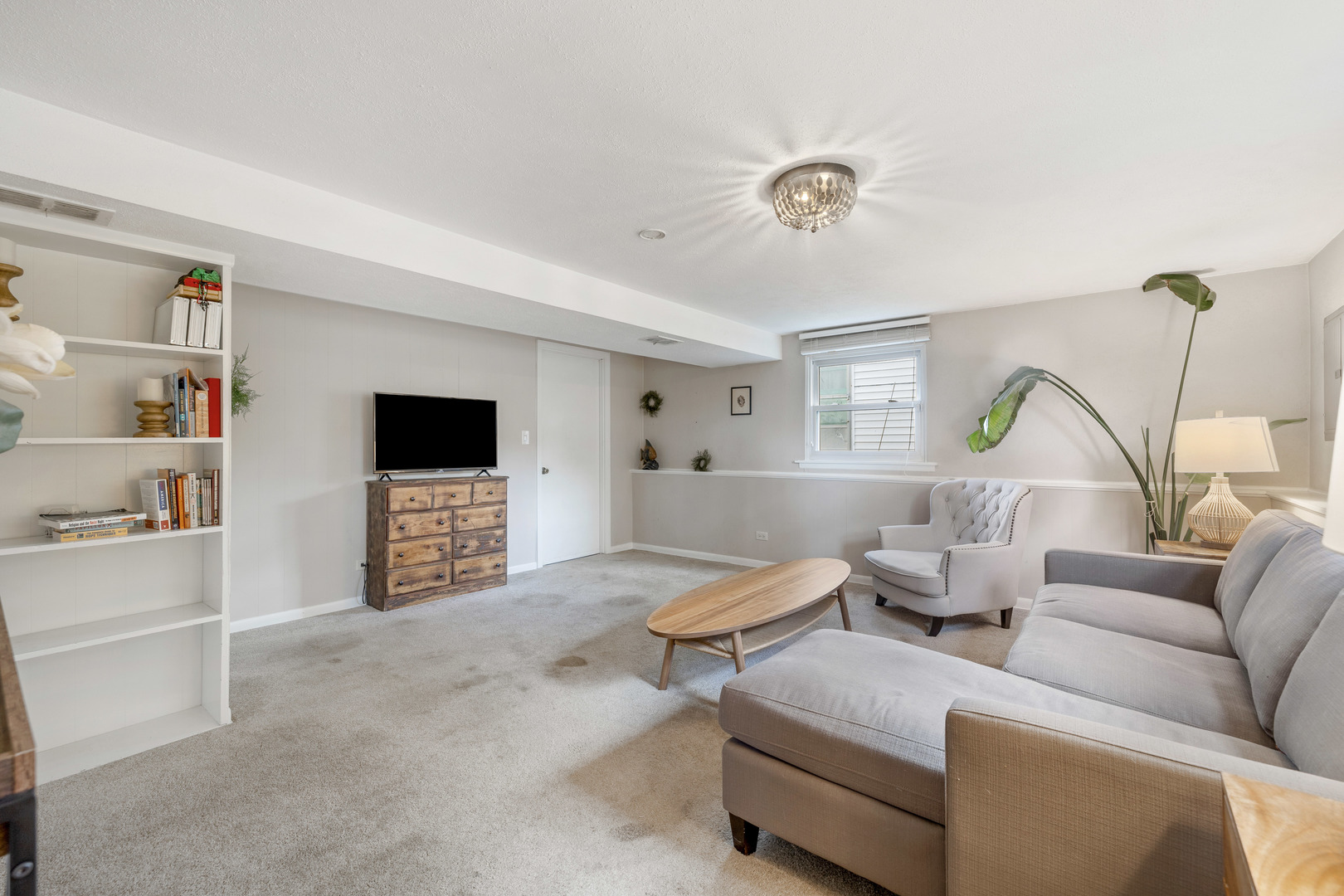 732 Sandy Lane Des Plaines, IL 60016 - Photo 13 of 17 a living room with furniture and a window