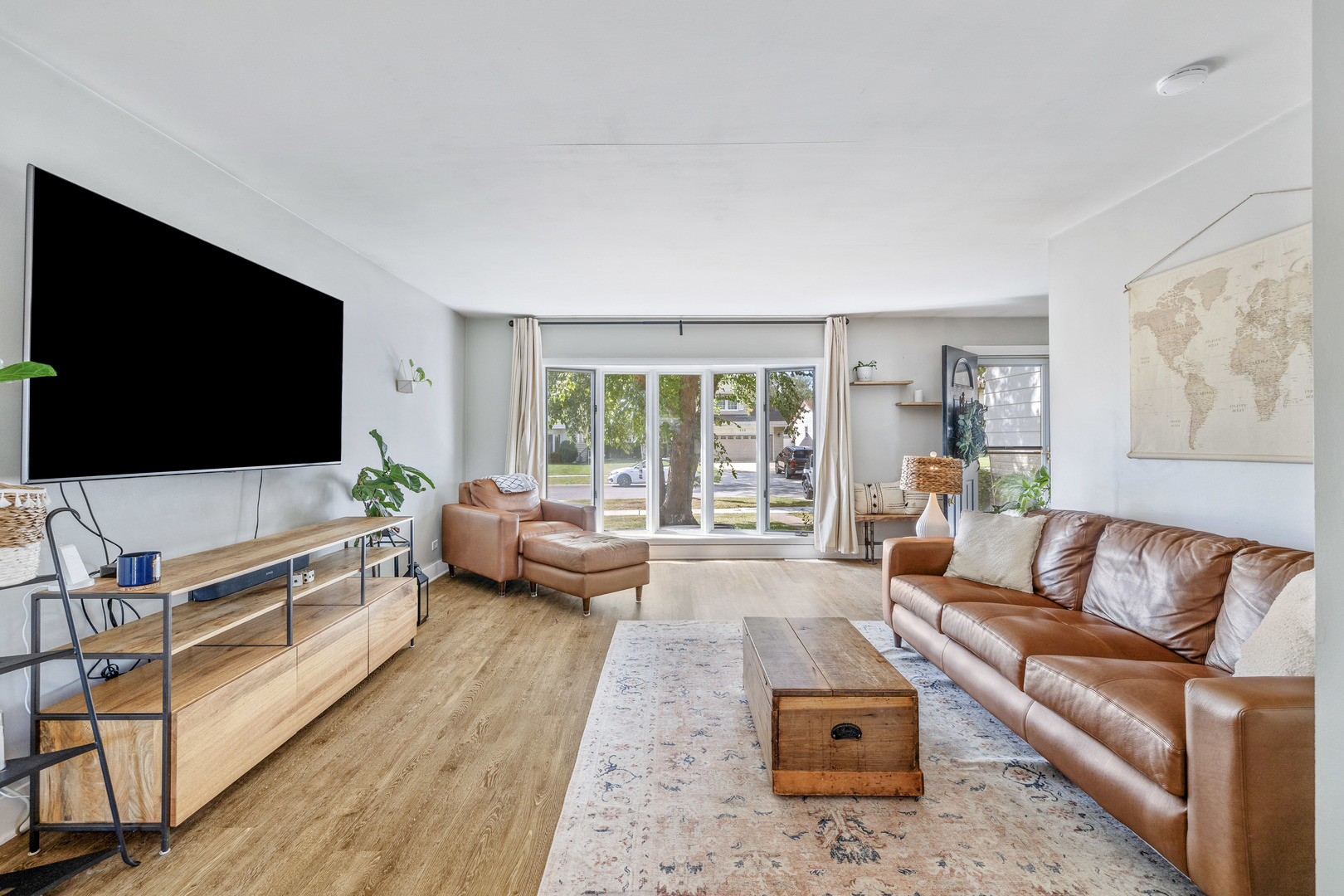 732 Sandy Lane Des Plaines, IL 60016 - Photo 6 of 17 a living room with furniture and a flat screen tv