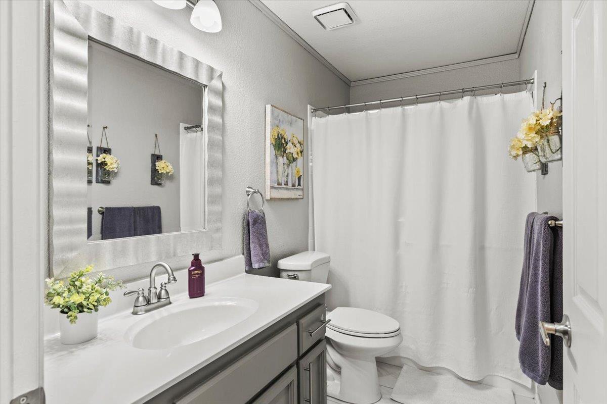 5303 Elgin Hills Way Antelope, CA 95843 - Photo 18 of 33 a bathroom with a sink toilet and shower