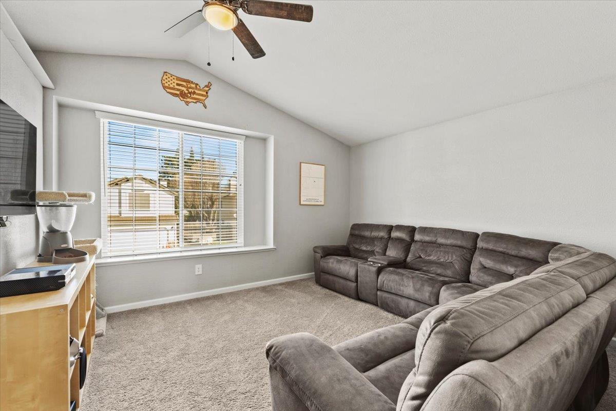 5303 Elgin Hills Way Antelope, CA 95843 - Photo 21 of 33 a living room with furniture and a flat screen tv