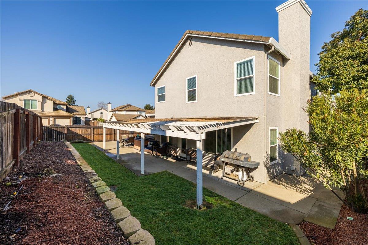 5303 Elgin Hills Way Antelope, CA 95843 - Photo 27 of 33 a view of a house with backyard and porch