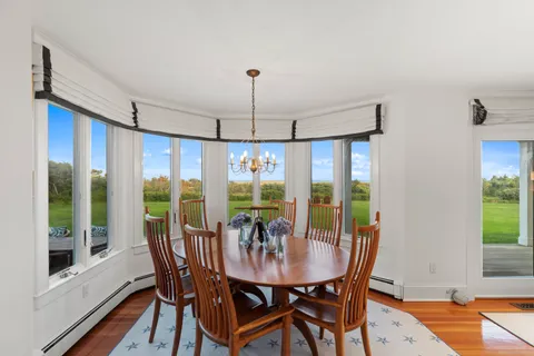 a very nice looking living room with furniture and a large window