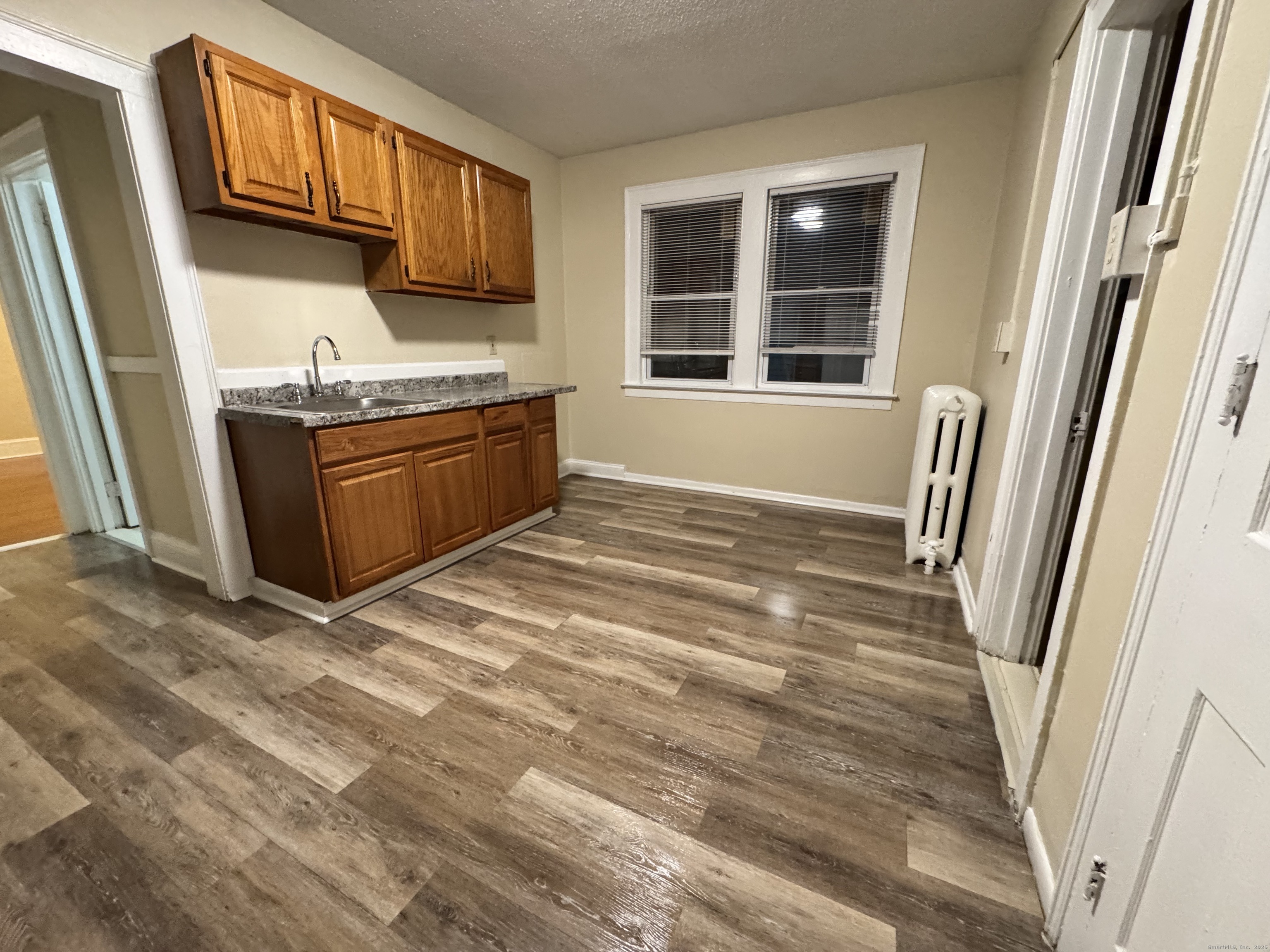 75 Whitmore Street Hartford, CT 06114 - Photo 3 of 6 a view of an empty room with a window
