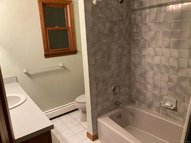 a bathroom with a tub and a shower