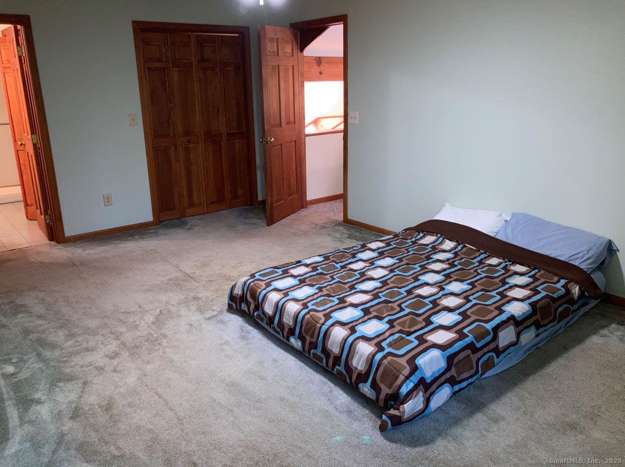 7 Morey Road New Milford, CT 06776 - Photo 19 of 25 a bedroom with a bed and window