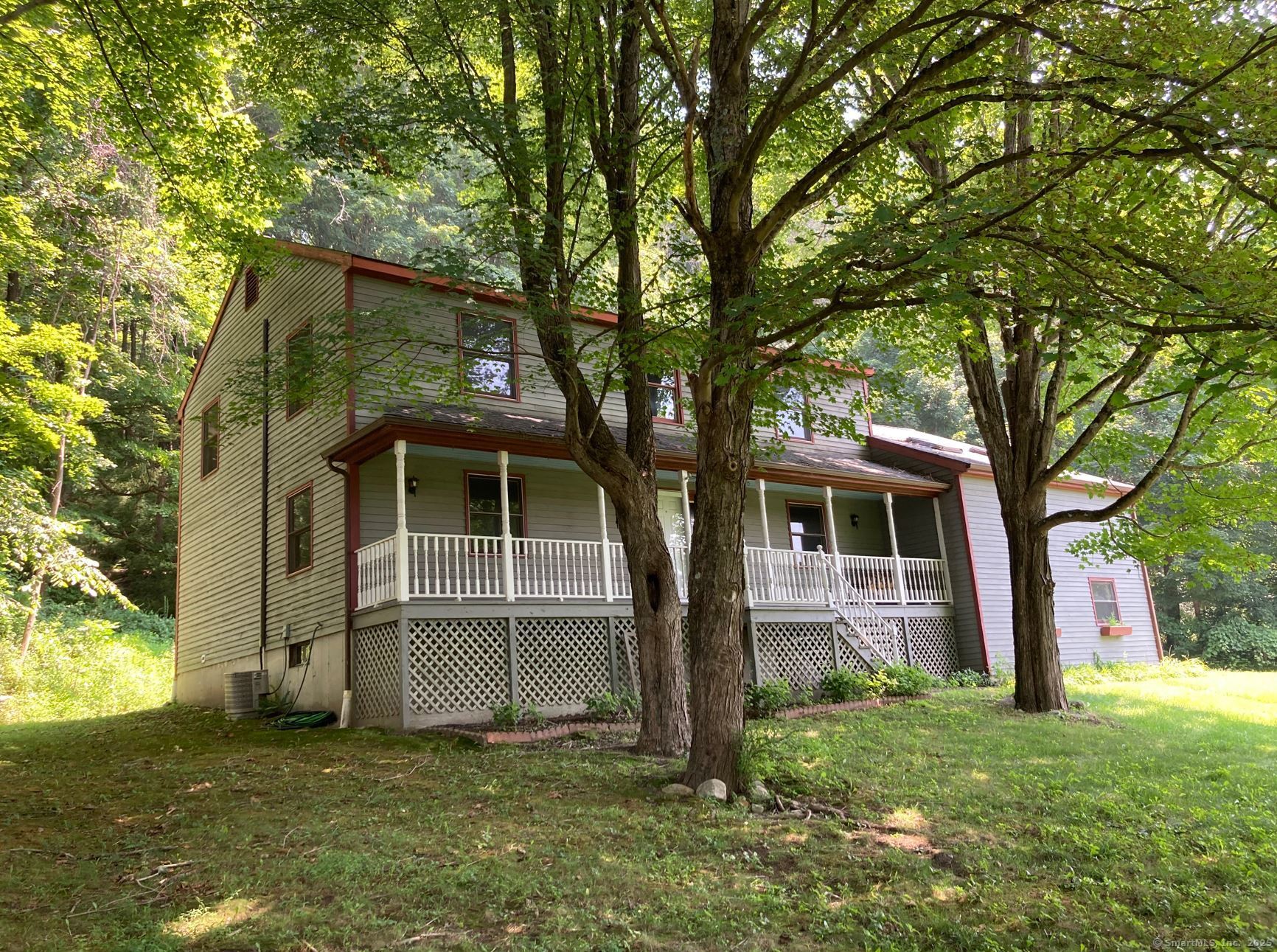 7 Morey Road New Milford, CT 06776 - Photo 3 of 25 a front view of house with yard and green space