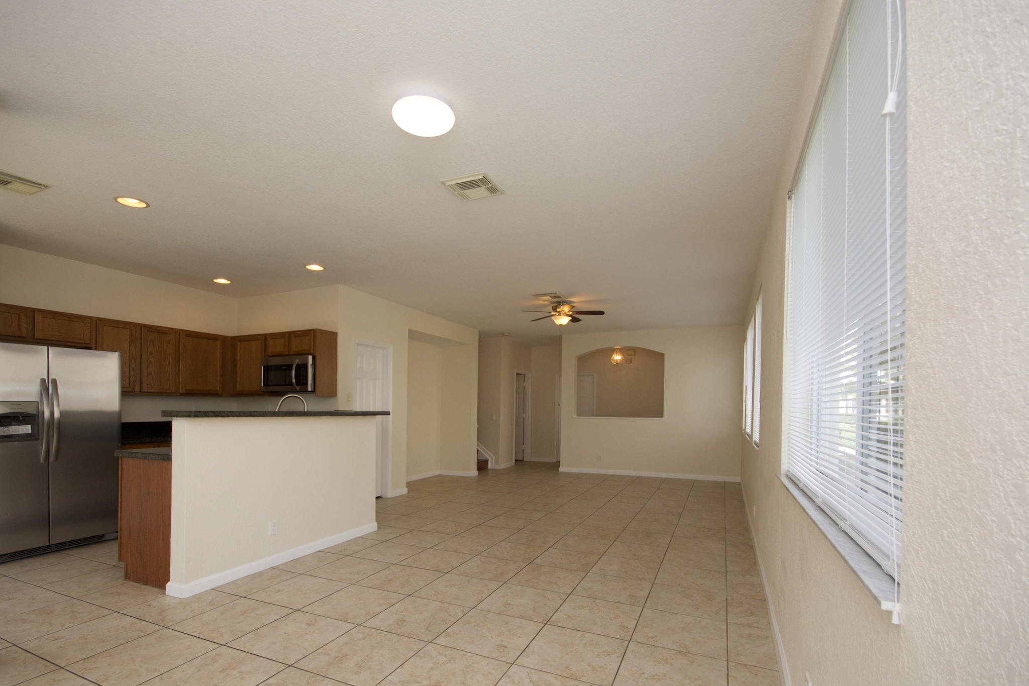 3227 Laurel Ridge Circle Riviera Beach, FL 33404 - Photo 8 of 27 a view of a kitchen with a sink and refrigerator