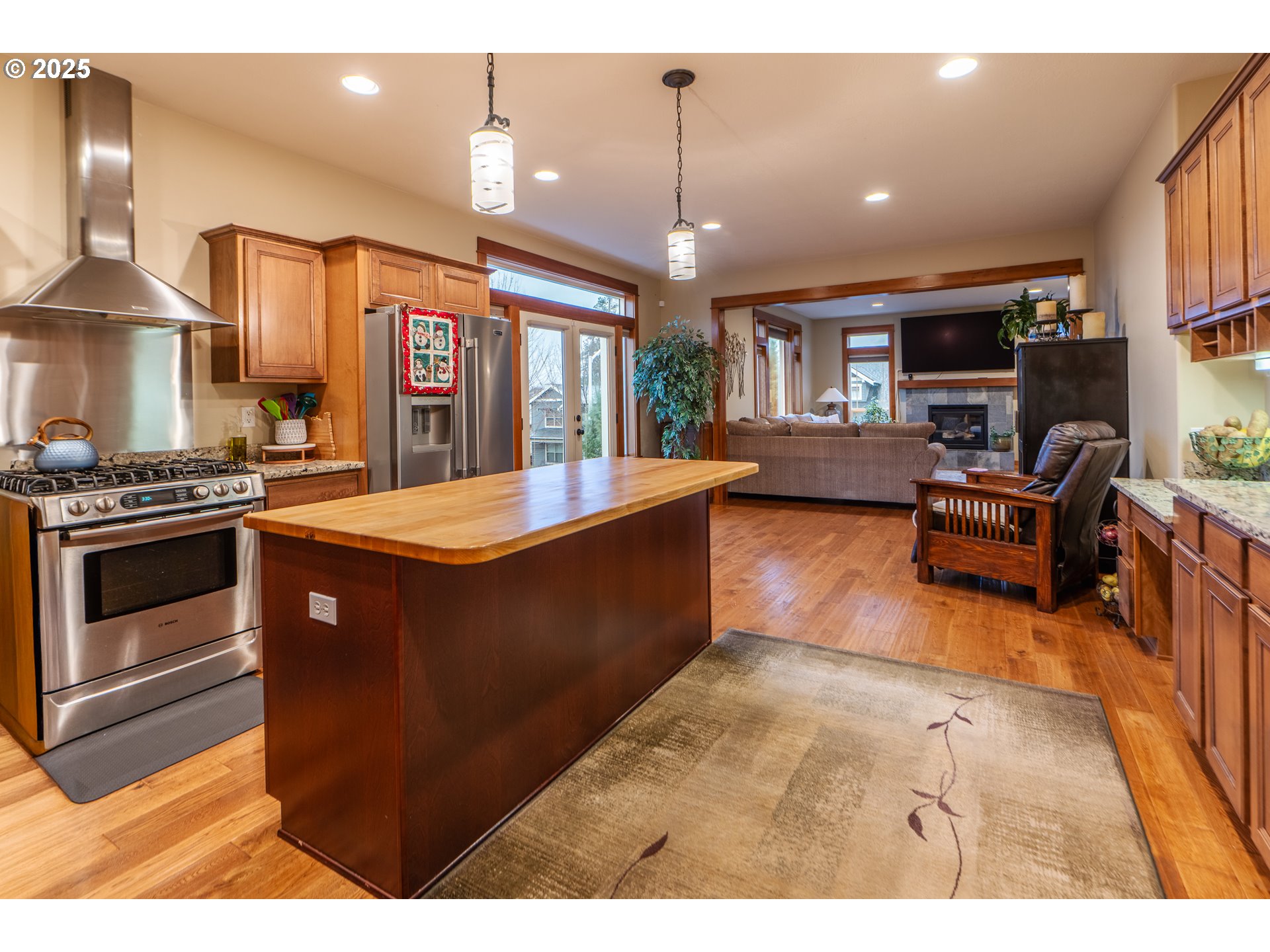 1110 Redtail Loop Hood River, OR 97031 - Photo 22 of 37 a kitchen with stainless steel appliances granite countertop a stove a sink and a refrigerator