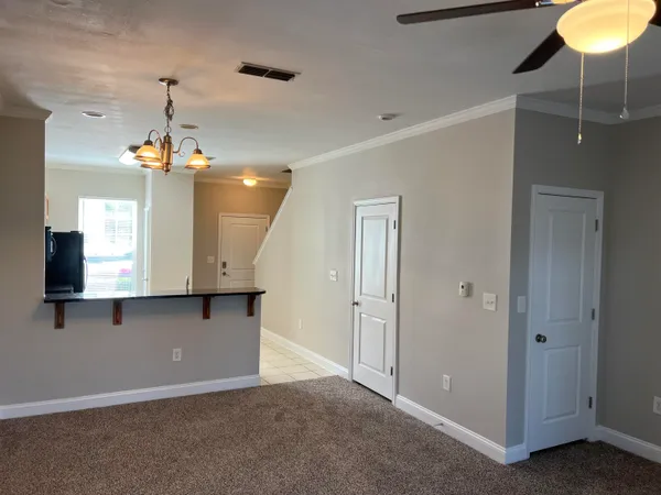 a view of a hallway with a chandelier