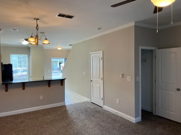 a view of a kitchen with a ceiling fan