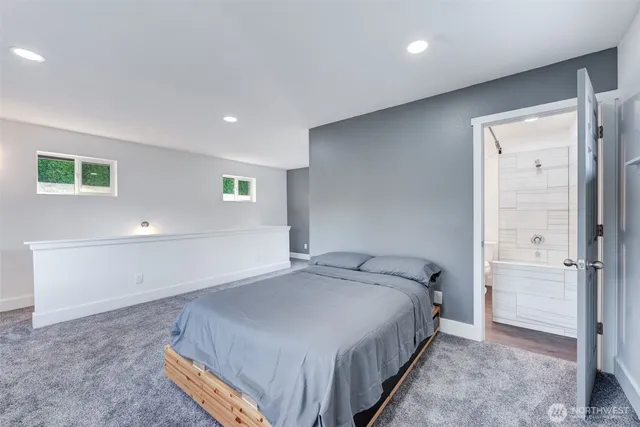 a bedroom with a bed and a painting