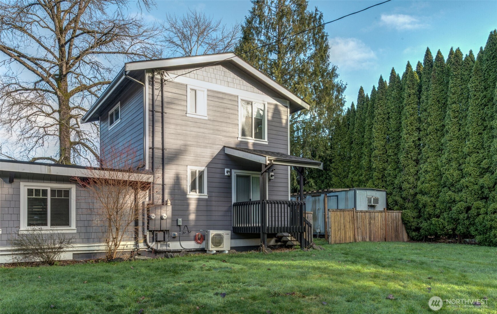 26015 166th Street Southeast, Unit B Monroe, WA 98272 - Photo 2 of 28 a front view of a house with a yard and green space