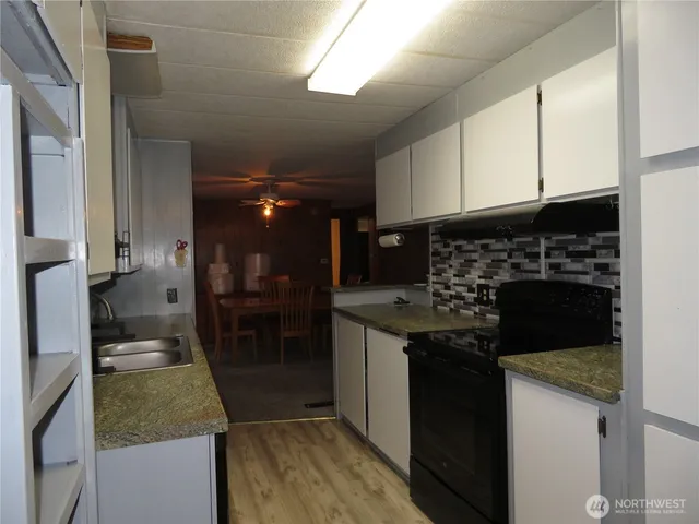 a kitchen with a sink and cabinets