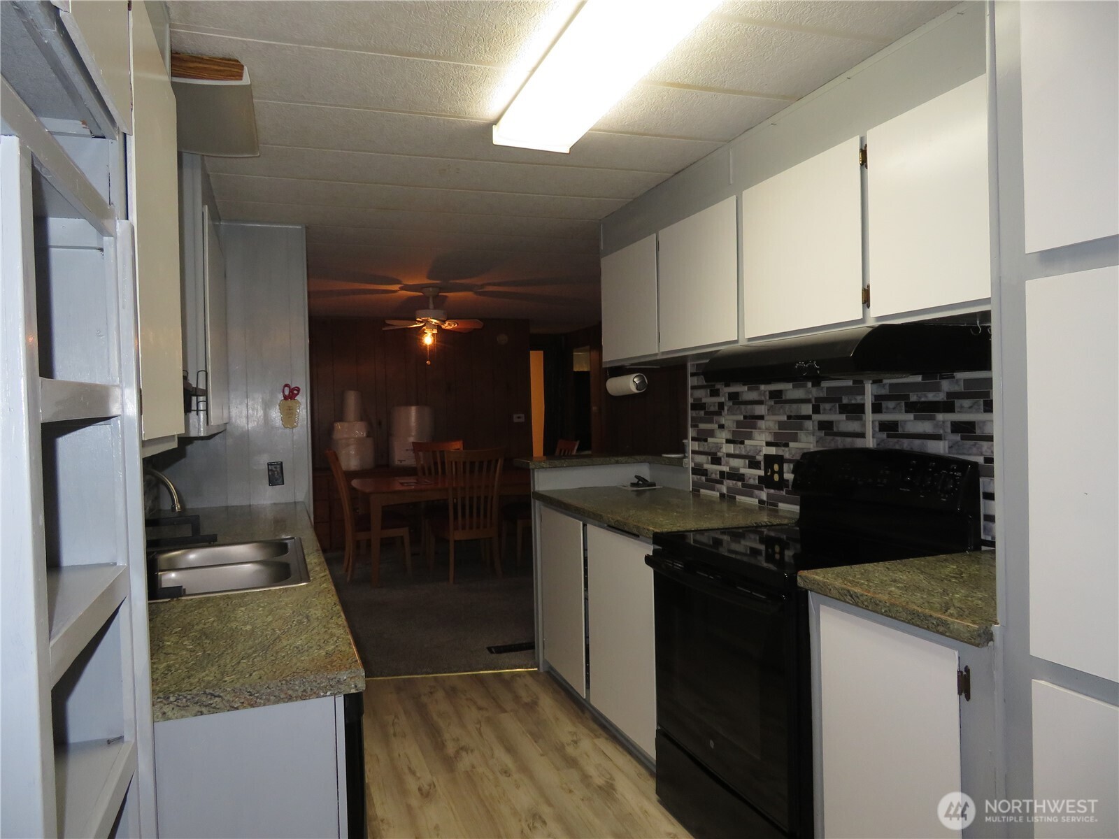 222 Delezenne Road Elma, WA 98541 - Photo 11 of 31 a kitchen with a sink and cabinets