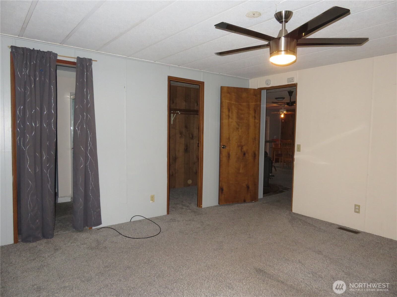 222 Delezenne Road Elma, WA 98541 - Photo 16 of 31 an empty room with closet and a ceiling fan