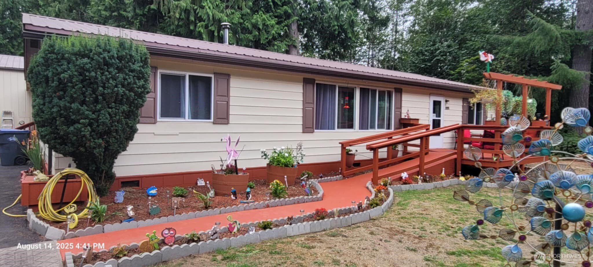 222 Delezenne Road Elma, WA 98541 - Photo 3 of 31 a view of a house with chairs and flower plants