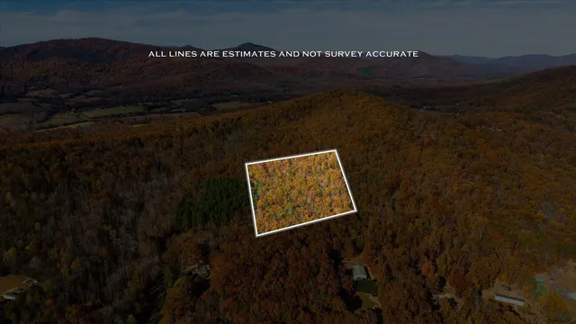 a view of a lush green hillside and a building